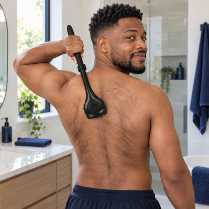 Thabo demonstrating the reach of a long-handled manual back shaver