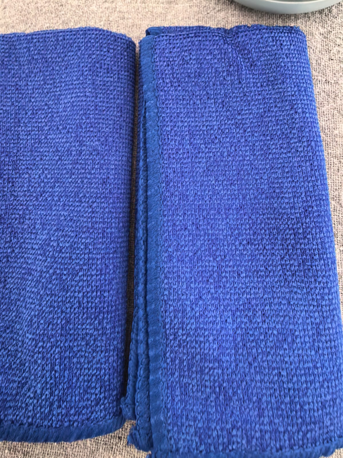 Two blue drying towels included with the dog paw washer kit
