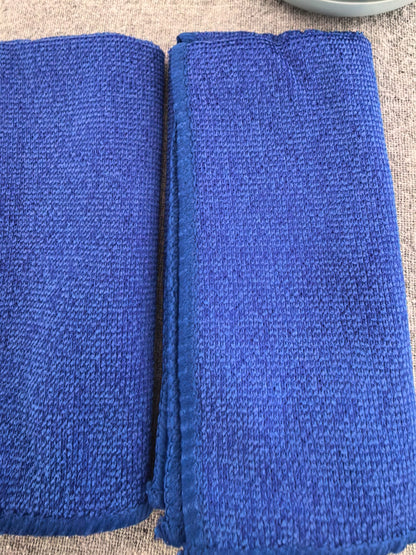 Two blue drying towels included with the dog paw washer kit